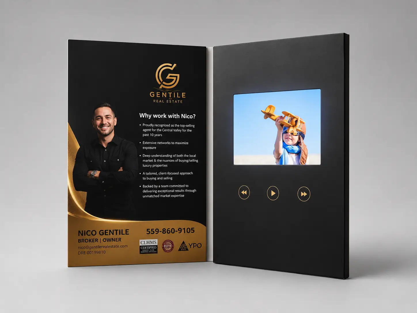 Photo of a video brochure sample being reviewed: screen on, packaging open, showing print quality and screen output